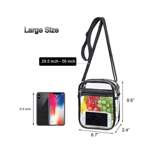 Large transparent PVC crossbody bag with black trim and adjustable strap for beach travel