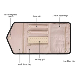 Pink jewelry travel organizer roll with magnetic closure and multiple storage pockets