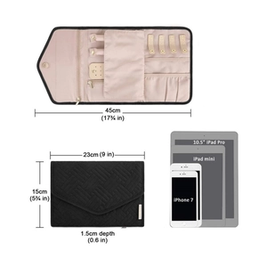 Portable black quilted travel jewelry organizer with pink lining and multi-compartments