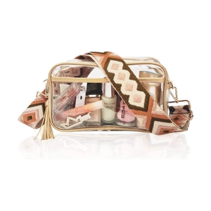 Close-up of clear PVC crossbody bag with wide geometric woven strap and gold zipper details
