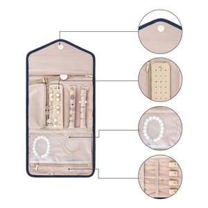 Portable foldable travel jewelry organizer with dedicated slots for necklaces and rings