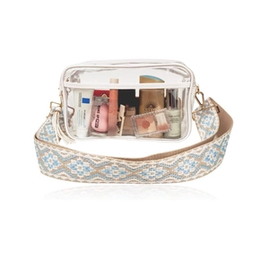 Detailed view of clear PVC crossbody bag showing internal capacity for cosmetics
