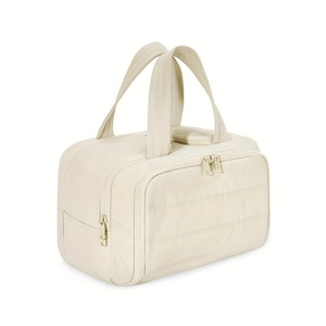 Cream quilted waterproof travel toiletry bag with double zippers and soft handles