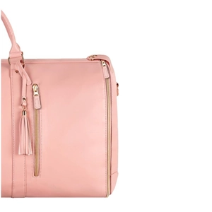 Pink faux leather large travel bag with gold zipper and stylish tassel detail