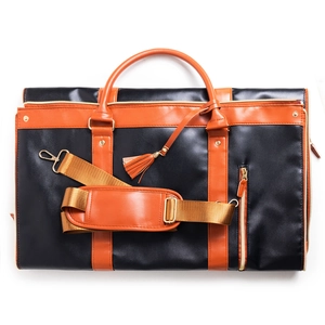 Close-up of PU leather travel bag details with golden zippers and tassel charm