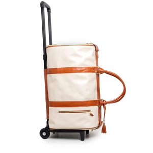 Close-up of rolling travel duffel with smooth wheels, telescopic handle and PU leather trim