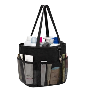Detail view of black mesh shower caddy showing multiple pockets and durable top handle