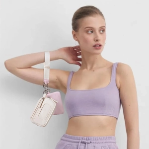 Detail of waterproof nylon mini pouch set with metal carabiner on a wide wrist strap