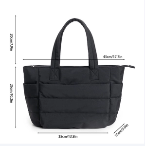 Detailed size chart of black quilted puffer tote bag with dimensions in cm and inches