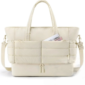 Detail view of puffer travel tote bag featuring quilted texture and separate shoe compartment