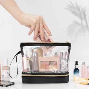 Trousse à maquillage double couche en PVC transparent avec base noire et zip doré pour voyage