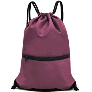 Detail of waterproof purple drawstring backpack featuring a front zipper pocket and cords