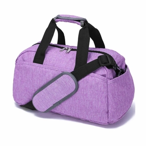 Detail view of purple sports bag showing durable textured fabric and metal dual zippers