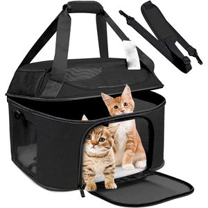 Close-up of black breathable pet carrier featuring mesh windows and soft white plush pad