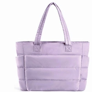 Chic quilted lavender tote bag with lightweight padded nylon and side pocket for travel
