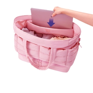 Pink quilted travel duffel bag with large capacity and laptop compartment for women