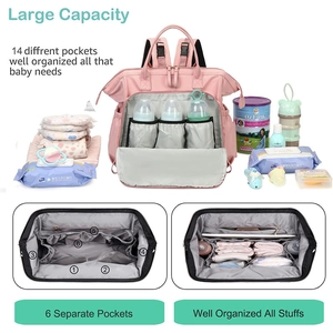Pink diaper bag detail showing 14 pockets and independent insulated baby bottle sections