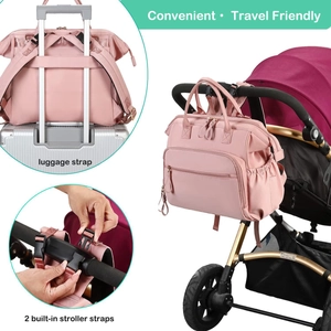 Detail of baby diaper bag showing luggage strap and stroller hooks for travel