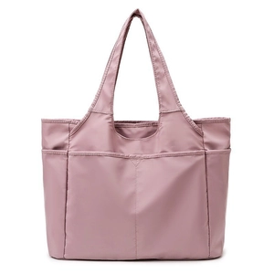 Grand sac de voyage rose en nylon avec plusieurs poches pour le yoga et le sport