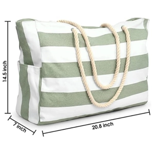 Large striped beach tote bag in sage green and white with rope handles and external pocket