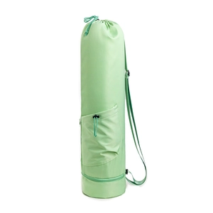 Detail of mint green yoga mat bag with adjustable strap and separate bottom wet compartment