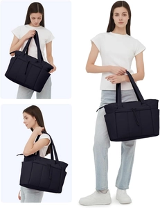 Detail view showing large capacity black quilted tote bag with practical side pockets