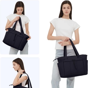 Quilted black nylon laptop tote bag for women featuring multi-pockets and drawstring design