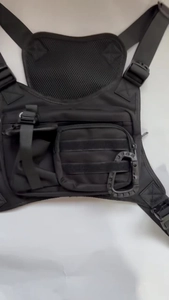 Close-up of tactical chest bag with MOLLE webbing and breathable mesh back for hiking