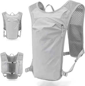 Detail view of lightweight light grey running vest with breathable mesh and buckles