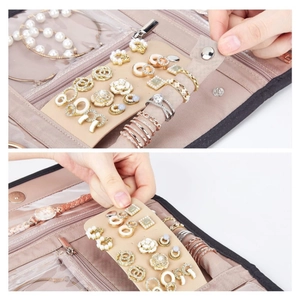 Nude pink faux suede jewelry roll organizer with slots for earrings rings and watches