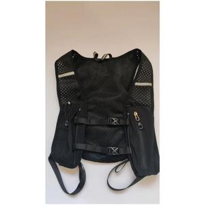 Close-up of lightweight cycling vest with breathable mesh and reflective strips for safety