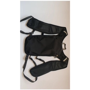 Close-up of lightweight black hydration vest with breathable mesh and reflective strips