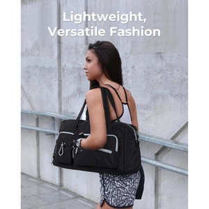 Fashionable black travel duffel bag with durable woven handles and functional front pockets