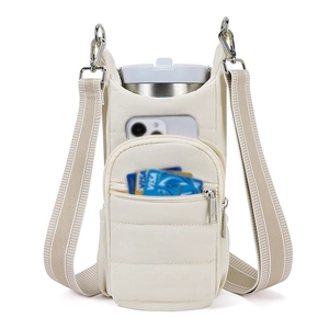 Quilted water bottle crossbody bag with cream fabric and striped detachable shoulder strap