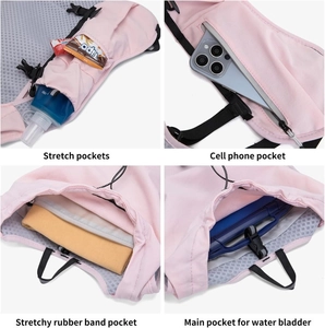 Pink marathon running vest with hydration bladder compartment and multiple mesh storage pockets