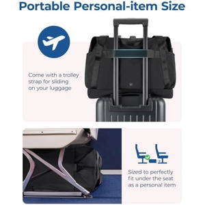 Detail of black travel bag with trolley strap fitting over luggage handle for easy boarding