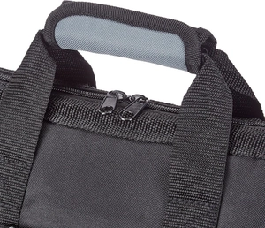Close-up of reinforced handle with breathable mesh and dual metal zippers on tool bag