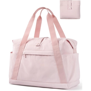 Detail of a pink foldable travel tote bag showing front zip pocket and compact folded form