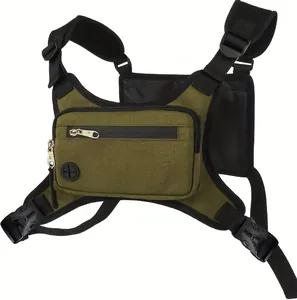 Detail of army green tactical chest bag with dual zippers and rubber headphone port