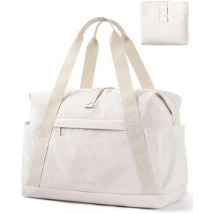 Detail of large travel duffel with side pockets and a matching folding storage pouch