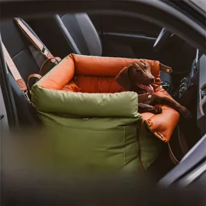 Army green leather car dog bed with orange lining and reinforced safety handle for travel