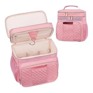 Pink quilted hanging toiletry bag with metal hook and mesh compartments for travel