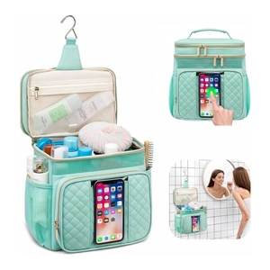 Hanging mint green toiletry bag with quilted design and clear waterproof phone pocket