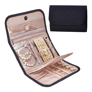 Black quilted faux suede travel jewelry roll organizer with champagne satin interior