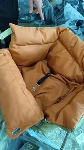 Detail showing the thick padded interior and safety tether of this green pet car seat