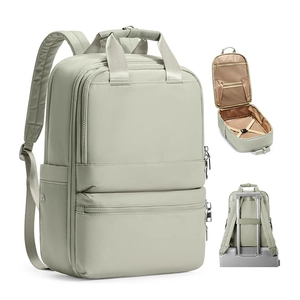 Detail of travel backpack showing 180-degree opening and luggage strap attachment