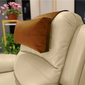Close-up of adjustable brown velvet headrest with non-slip base for neck support