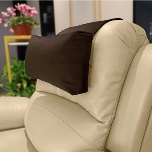 Detail view of coffee velvet recliner headrest with non-slip flap for sofa and lounge chair