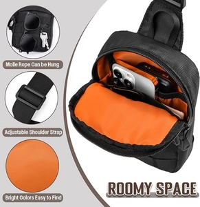 Detail of black tactical crossbody bag showing Molle system and orange lining