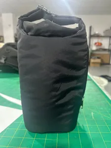 Detail of black insulated water bottle bag with roll-top buckle and side zipper